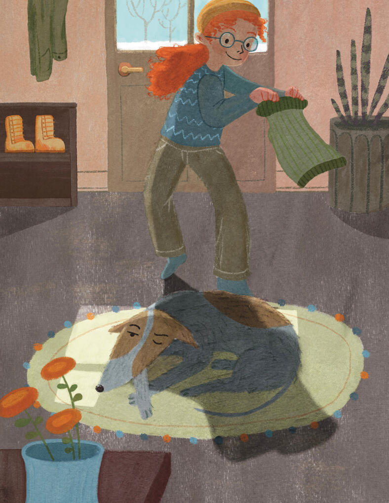 A girl sneaks up on her sleeping dog holding out a sweater.